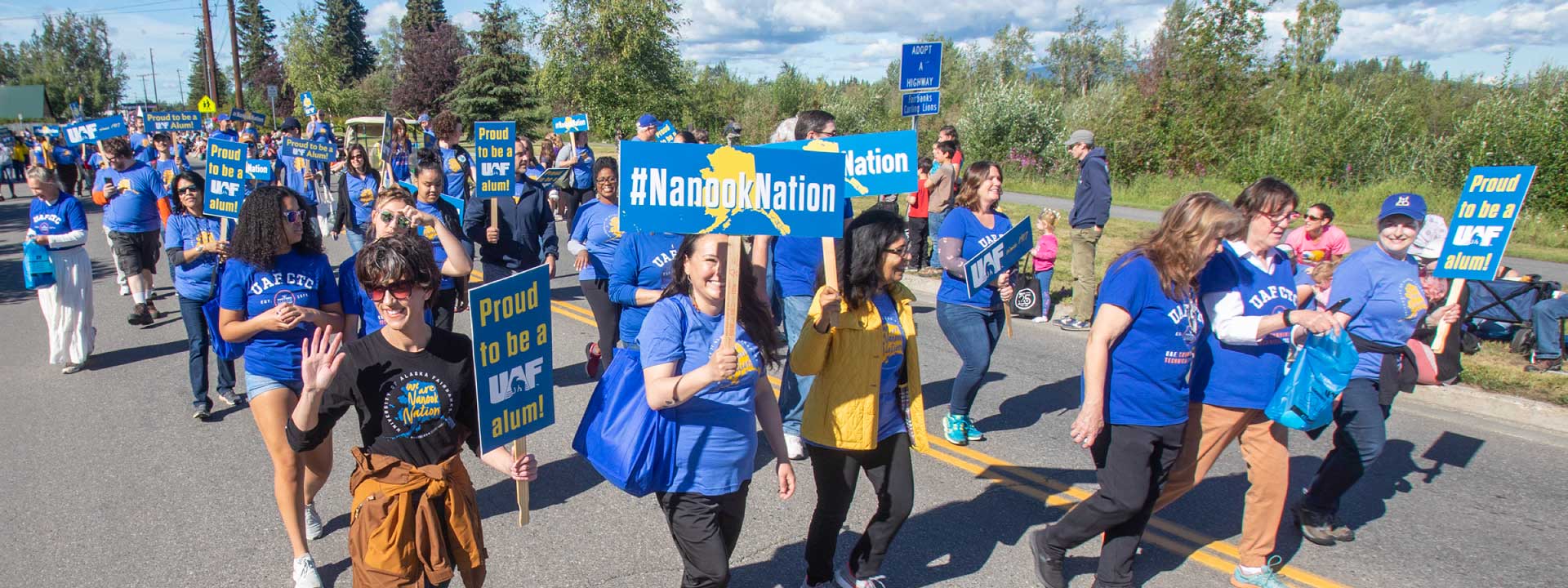 UAF employees walk in a parade.