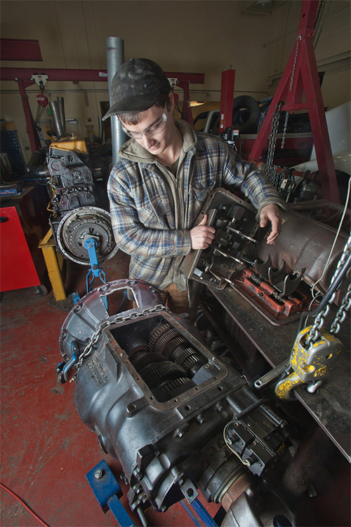 CTC student inspects transmission as part of a diesel mechanics course