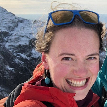 Outdoor portrait of Megan Behnke with mountain in the background