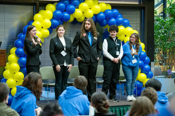 Student panelists steated at a long table