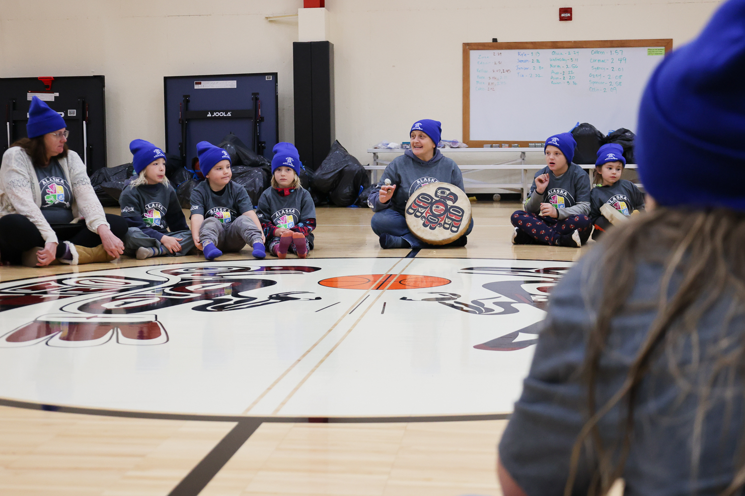 Klukwan School educator and Alaska EPSCoR advisory board member Justina Starzynski-Hotch leads students in a Tlingit chant sung daily at Klukwan School.