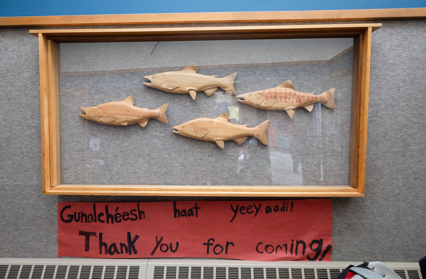 A sign by the front door of Klukwan School reads, "Gunalchéesh haat yeey.aadí! Thank you for coming!"