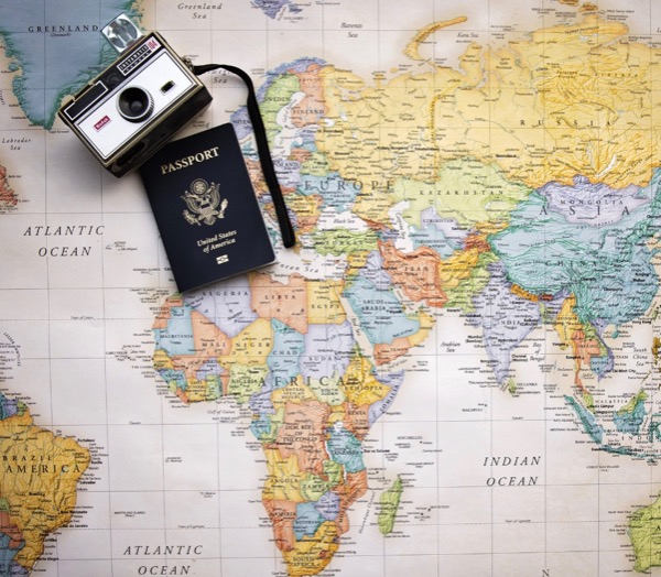 Map of eastern hemisphere with camera and passport