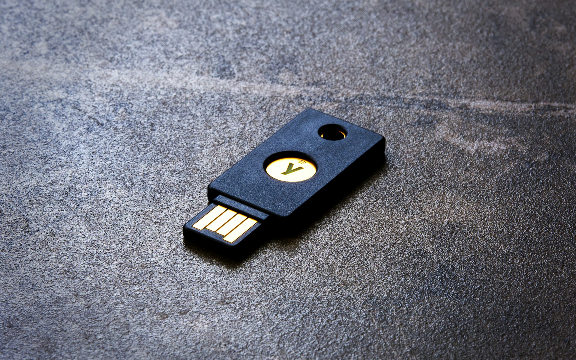 black thumb drive on gray surface