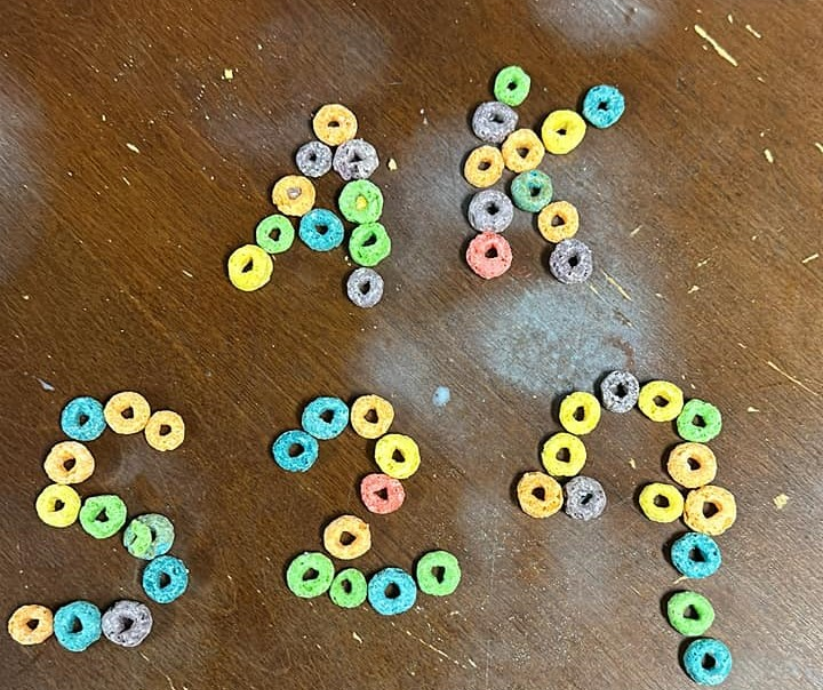 the letters 5, 2, and 9 are shaped in froot loops
