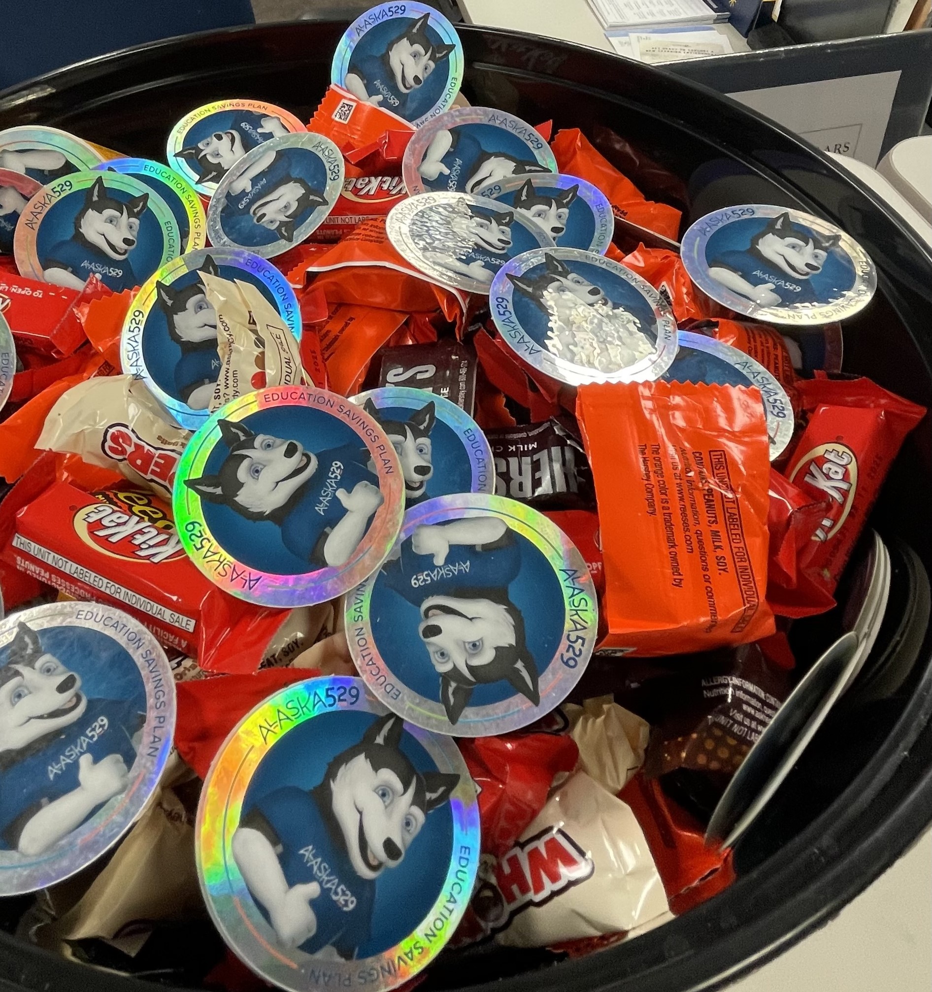 a bowl of candy and branded 529 goodies