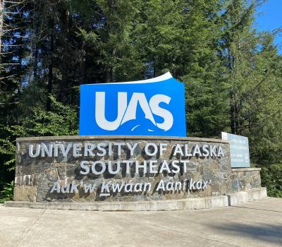 A sign for UAS at the entrance of campus