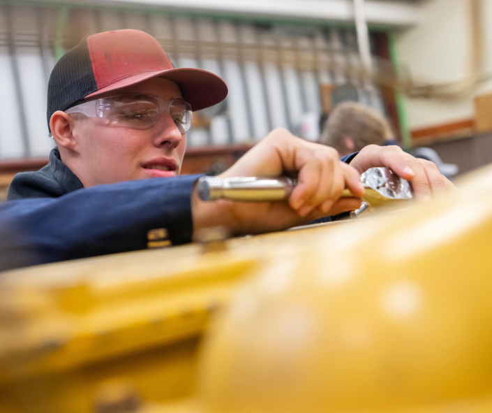 A UA student works on a project in a construction-related course