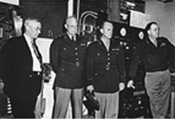 Army Chief of Staff General Dwight D. Eisenhower tours the University of Alaska campus. From left are President Bunnell, General Dwight D. Eisenhower and staff. Photo: UAF Rasmuson Library