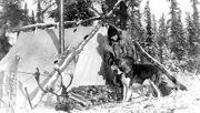 Margaret Murie and dog by camp tent. Photo: Murie Collection